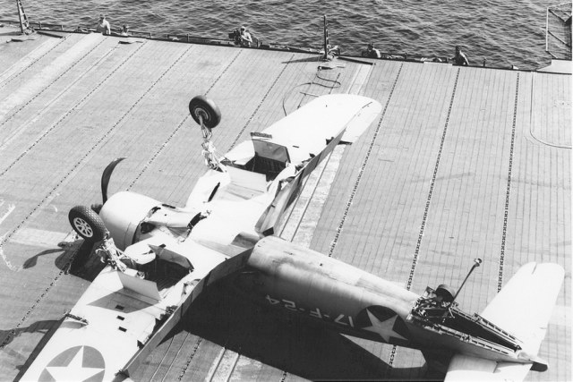 F4U-1CorsairaircraftofVF-17iscrashingontheflightdeckofUSSBunkerHillCV-19_zpsfc278347.jpg