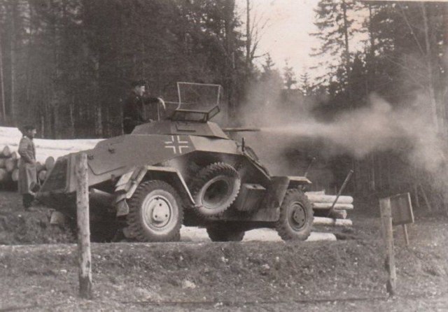 A German SdKfz 222 opens fire with its 20 mm gun.jpg