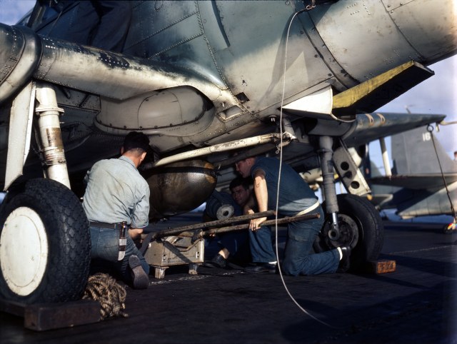 Aviation_Ordnancemen_loading_a_bomb_on_a_Douglas_SBD-5_Dauntless,_circa_1943-1944_(80-G-K-15951).jpg