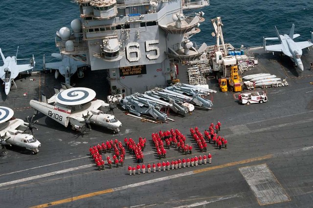 aviation_ordnancemen_stand_together_for_a_photo_on_the_flight_deck (1).jpg