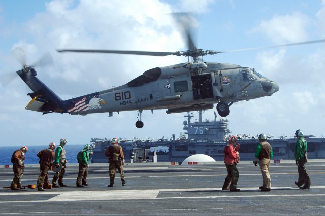 Valiant_Shield_-_helicopter_on_USS_Kitty_Hawk.jpg