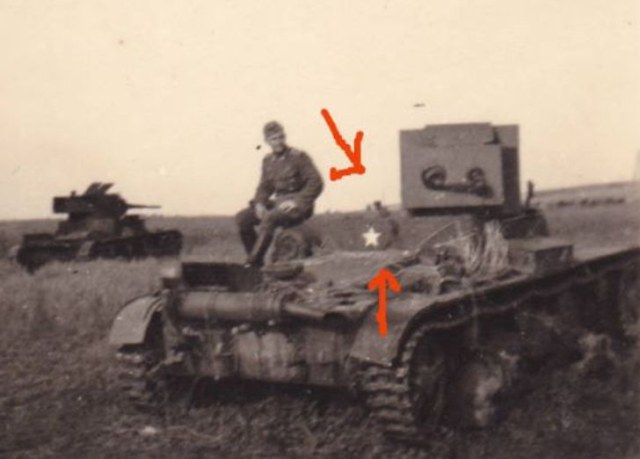 Немецкий солдат на подбитом советском огнеметном танке ХТ-26.jpg