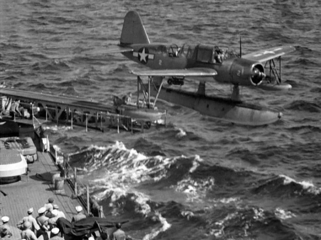The number 2 OS2U Kingfisher launches from cruiser USS ASTORIA's port catapult, July 1944..jpg
