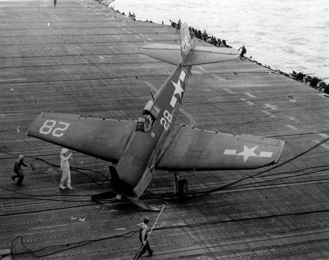 F6F-3_Hellcat_28_of_VF-1_after_engaging_the_barricade_on_the_flight_deck_of_the_carrier_USS_Hornet_CV-12_Battle_of_the_Philippine_Sea_on_June_19_1944.jpg